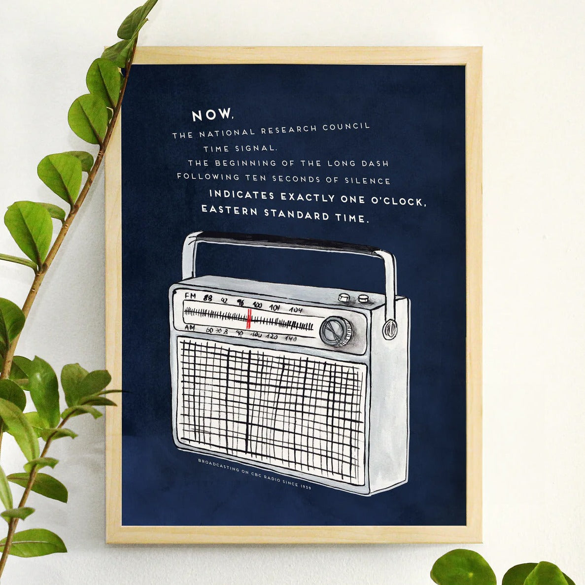 CBC Radio Print in a frame on the wall with plants