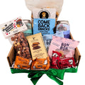 Assorted snack items including truffle pig, come back snacks, and other packaged goods in a box with a green ribbon.
