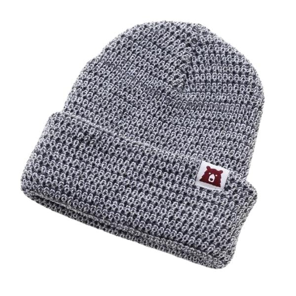 Plain light grey marl toque with tiny white label with bear logo on it.
