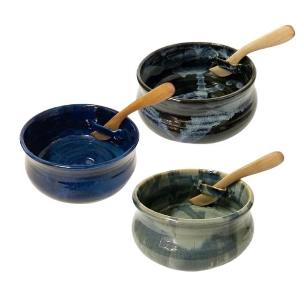 Three ceramic dip bowls with slot on side to hold a wooden knife.