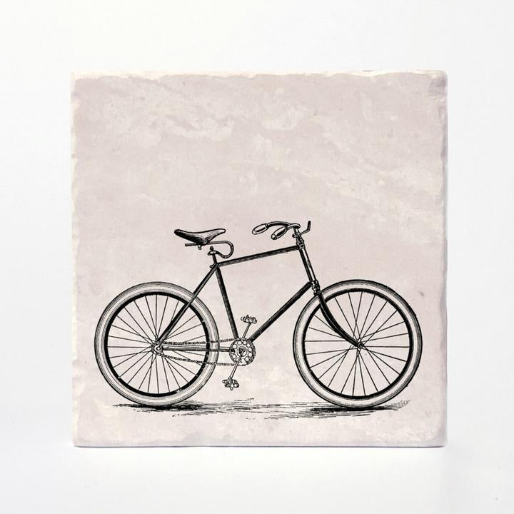 A coaster with a vintage bike printed on it.