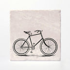 A coaster with a vintage bike printed on it.