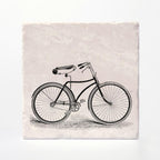 A coaster with a vintage bike printed on it.