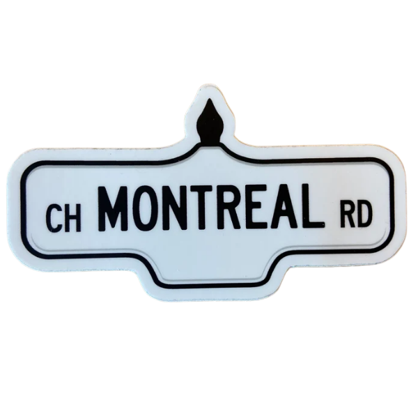 Sticker of a white street sign with black text that reads 'Ch Montreal Rd'.