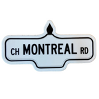 Sticker of a white street sign with black text that reads 'Ch Montreal Rd'.