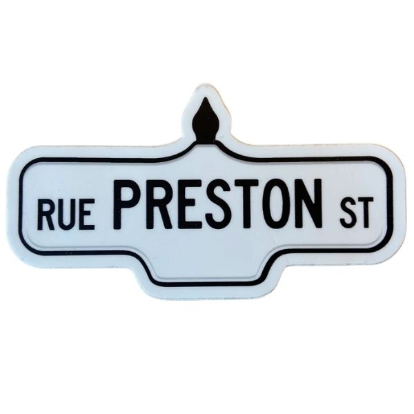 Sticker of a white street sign with black text that reads 'Rue Preston St.'