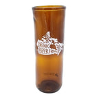 Tall brown transparent glass tumbler with a white outline image of a map of canada. Text within the map reads "Drink Beer from here".
