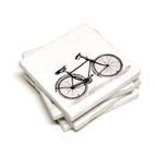 A coaster with a vintage bike printed on it.